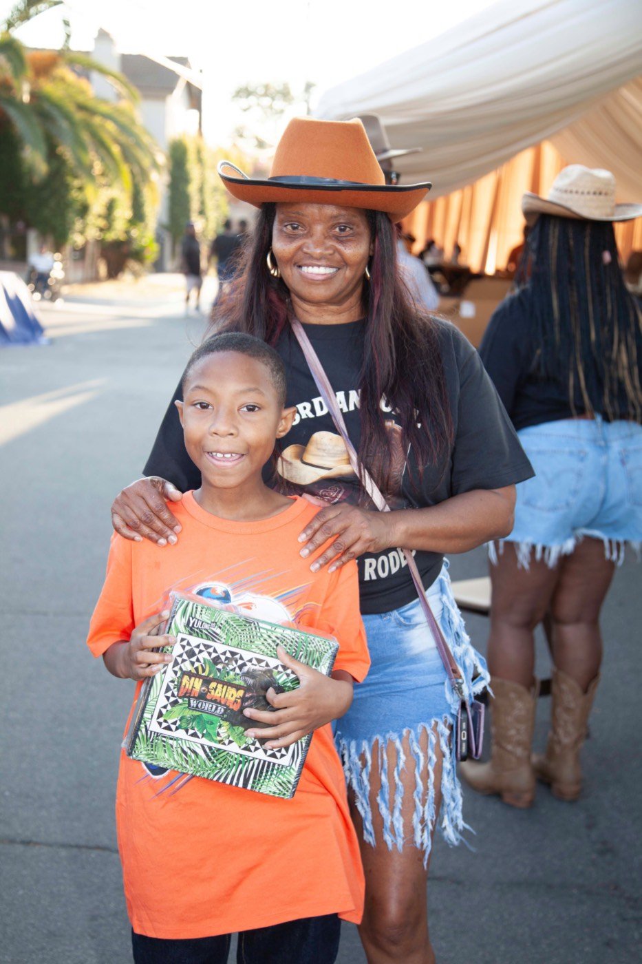 Cassandra with a child at the school-supply giveaway